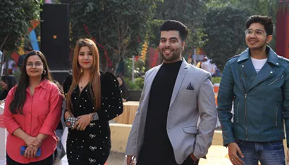 Two alumni smiling together at the event