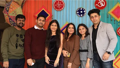 A batch of alumni posing together for a photo