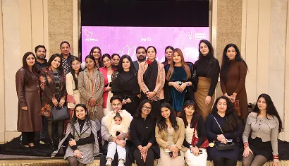 A batch of alumni posing together for a photo
