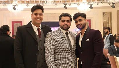 A batch of alumni posing together for a photo